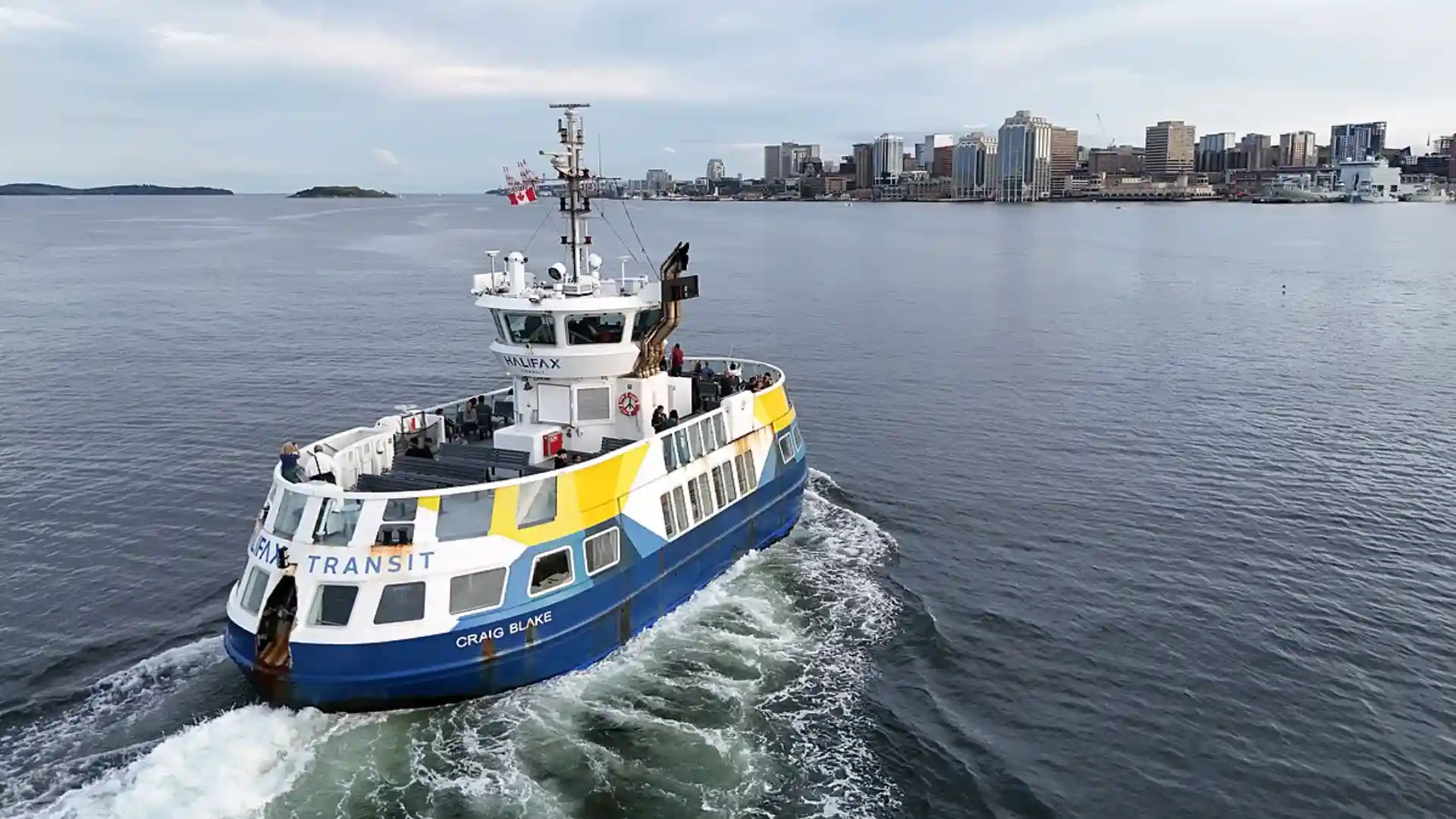 Halifax Transit ferry navigating the harbor with city skyline in the background